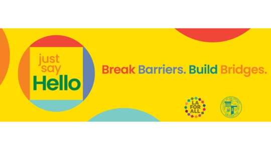 Just Say Hello logo on a yellow background, with tag line that says "Break Barriers. Build Bridges."