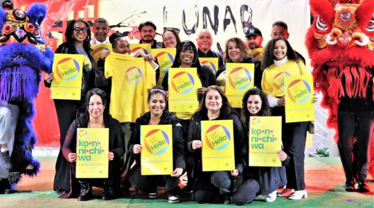 JSH Volunteers and Staff holding up the JSH Posters