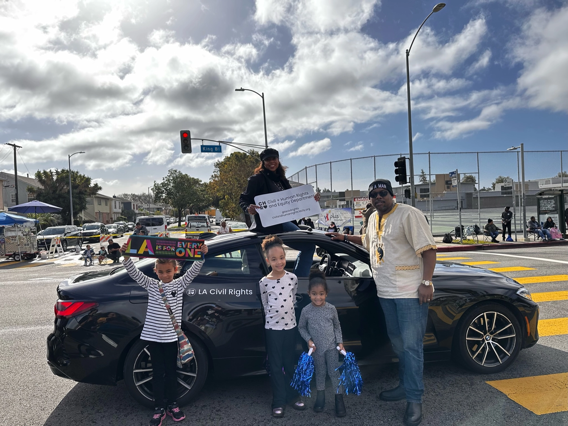 Capri Maddox poses with parade watchers at the 38th Annual Kingdom Day Parade