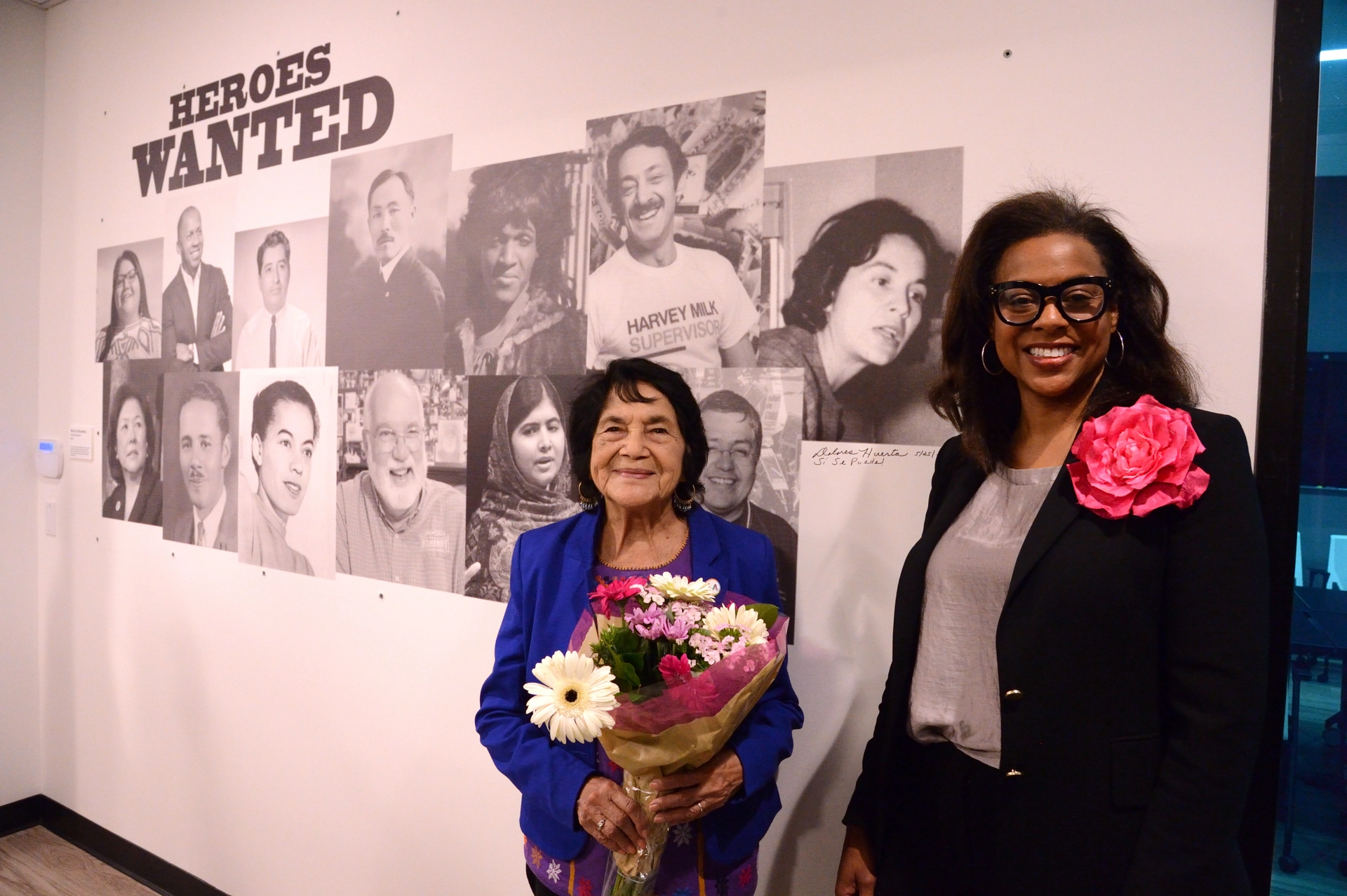 Dolores Huerta and LA Civil Rights Executive Director Capri Maddox photo next to "Heroes Wanted" mural