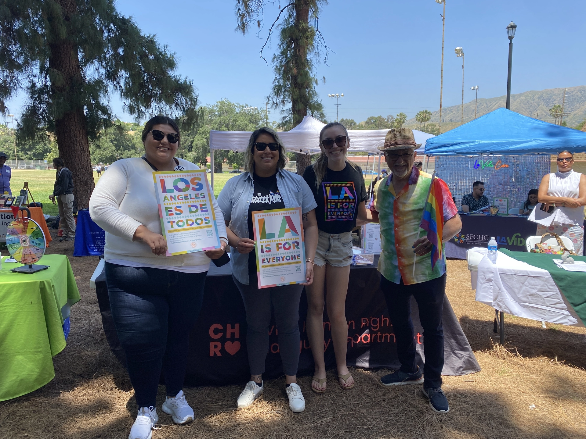 LACR photo with community member at tabling event