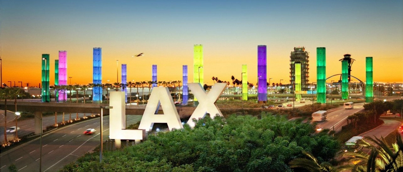 Los Angeles International Airport pillars lit up in LA For All colors