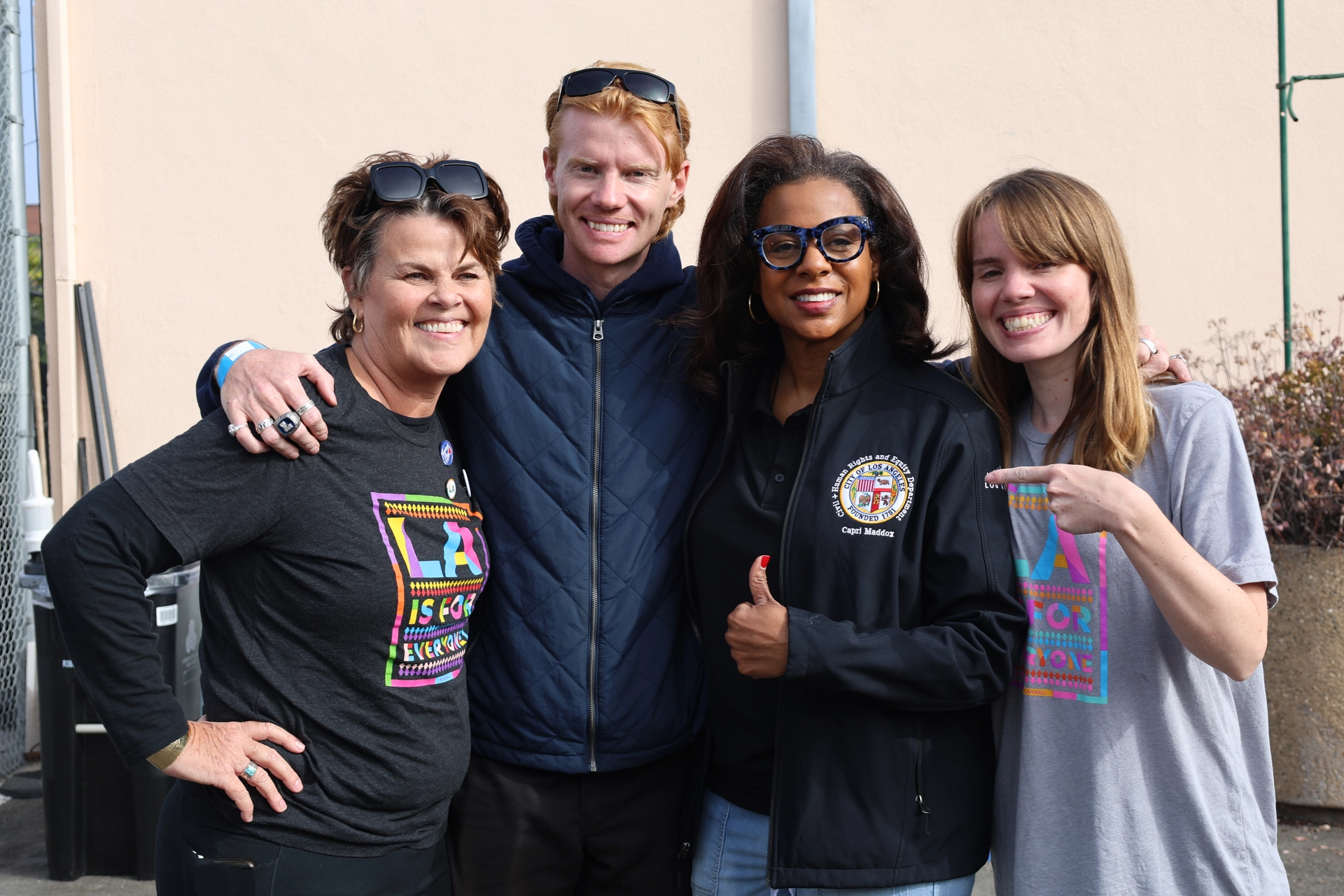 Executive Director Maddox posing for a photo with the LaBonge Family at the Annual Tom LaBonge Day of Service