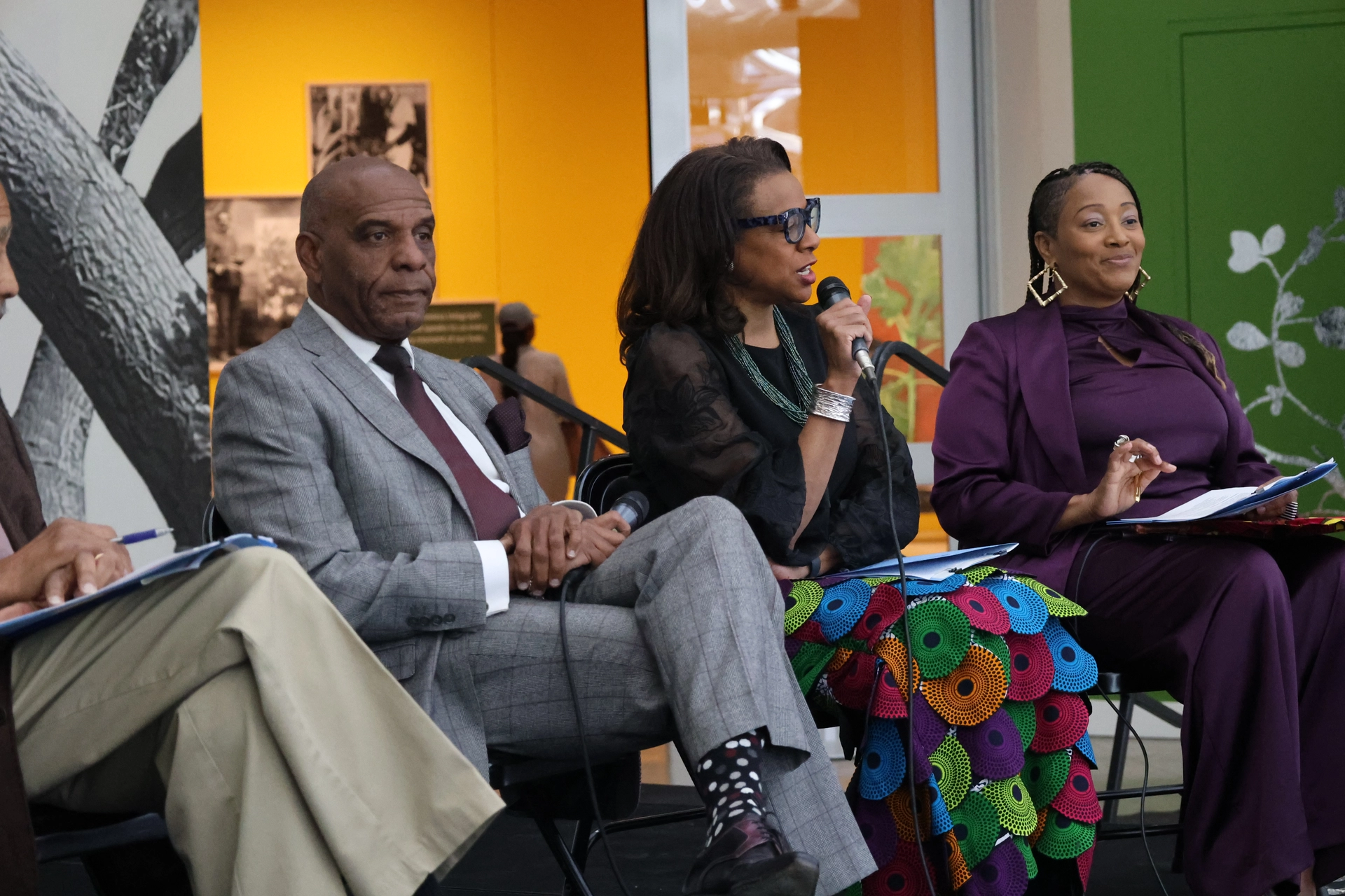 Capri speaks at the reparations report panel.