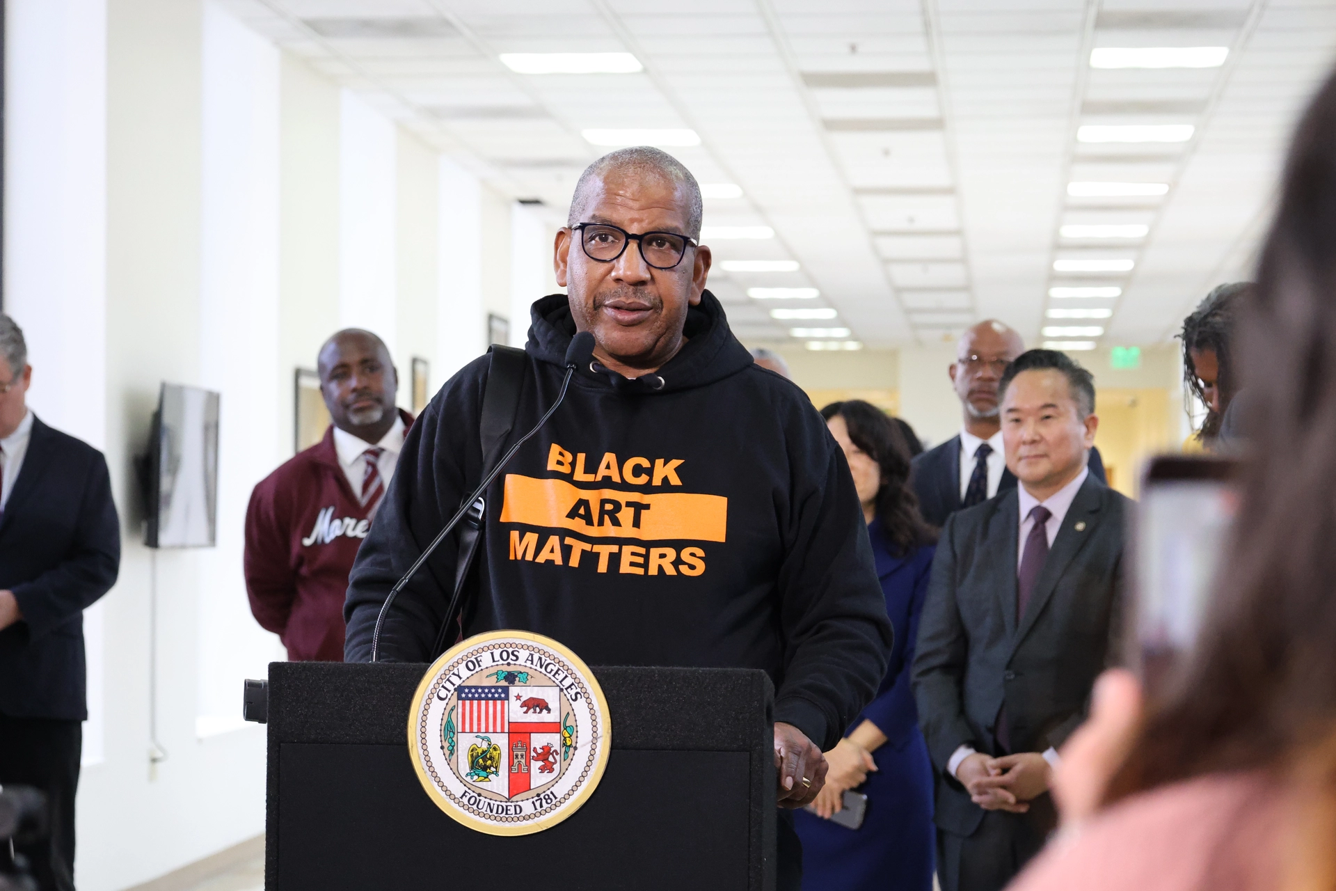 Leroy Hamilton speaks at the podium.