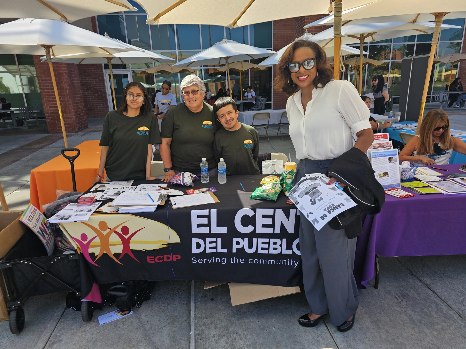 Capri Maddox, Executive Director of LA Civil Rights, poses with volunteers from El Centro Del Pueblo (ECDP) at Cal State LA’s Know Your Rights resource fair, where more than a dozen community organizations shared information and resources.