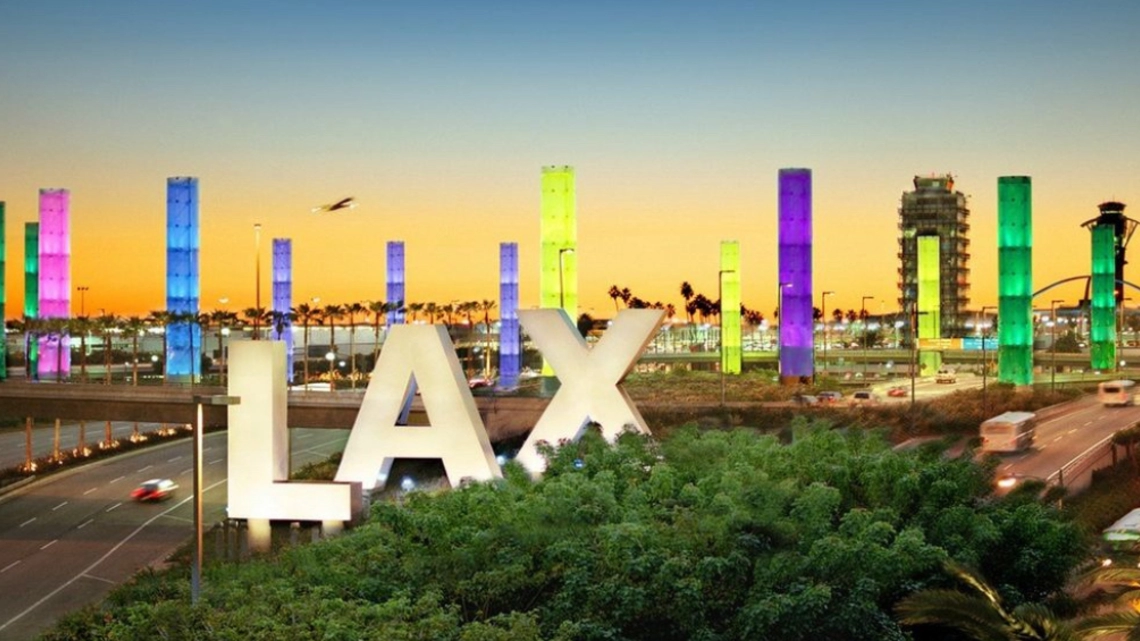 Los Angeles International Airport pillars lit up in LA For All colors