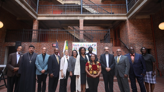 Capri Maddox stands with faith and community leaders at the Unity Event held on October 11, 2022.