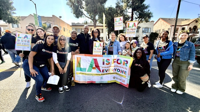 LA Civil Rights staff and Black Worker Center staff hold up LA is For All signage.