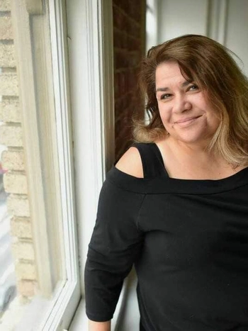Alison Simard headshot wearing a black blouse