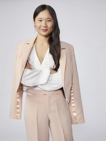 CCR Commissioner Lacy Lew Nguyen Wright headshot photo of her in a light pink pant suit