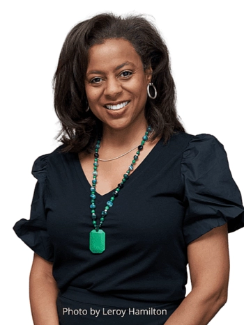 Photo of Capri Maddox wearing green necklace